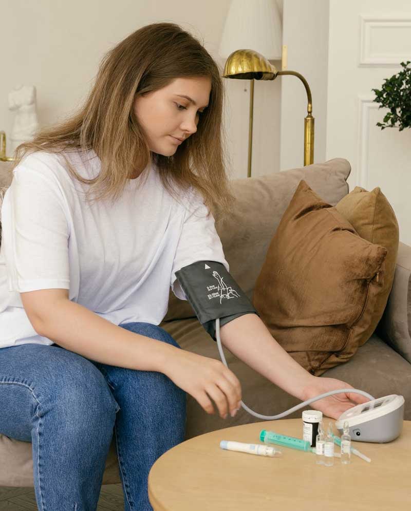 Woman checking blood pressure